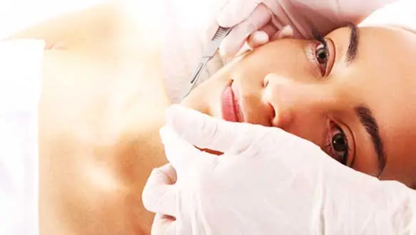 showing woman receiving a deramaplane facial treatment