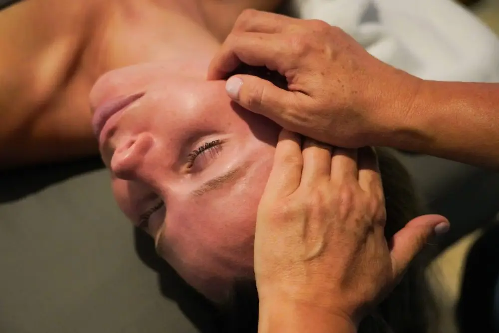 Spa client relaxed during a session of Hadado facial massage techniques