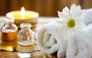 Spa towels, candle and essential oils